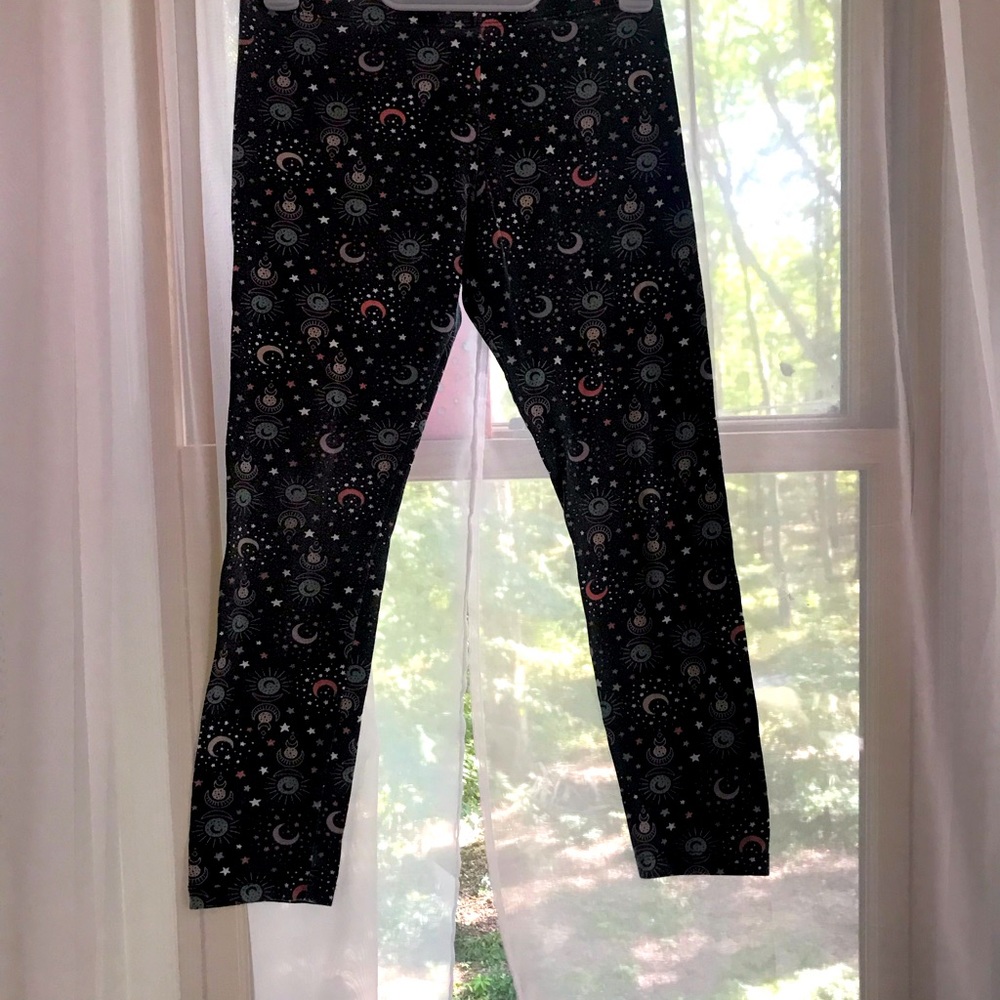 So these pants have moons in and stars and suns  on them and they are for girls